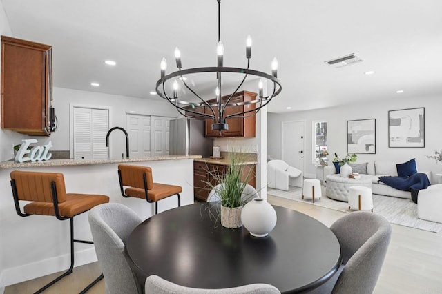 6876 Bear River Row Unit 3, San Diego, CA 92139 - dining space featuring a chandelier, recessed lighting, and light wood-style floors