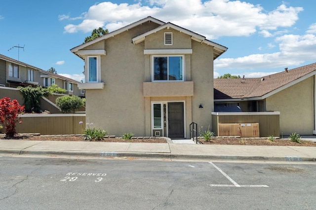 6876 Bear River Row Unit 3, San Diego, CA 92139 - view of front facade featuring stucco siding and uncovered parking