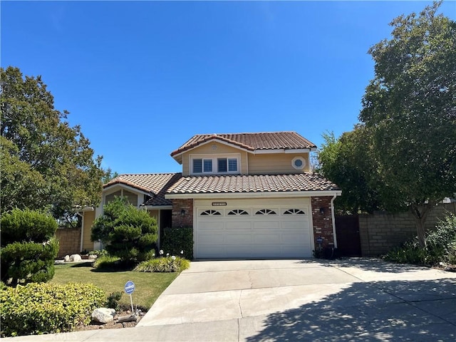 17252 Wentzel Way, Granada Hills, CA 91344 - view of front facade with a tiled roof, driveway, a garage, and brick siding