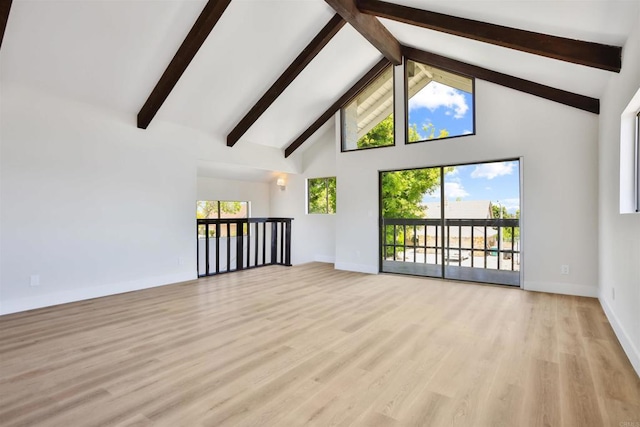 286 E Mission Rd, Corona, CA 92879 - unfurnished living room featuring high vaulted ceiling, beam ceiling, wood finished floors, and healthy amount of natural light