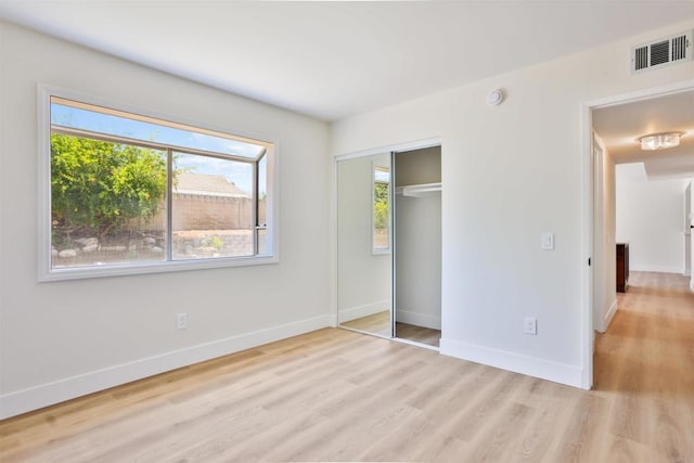 286 E Mission Rd, Corona, CA 92879 - unfurnished bedroom with light wood-type flooring and a closet