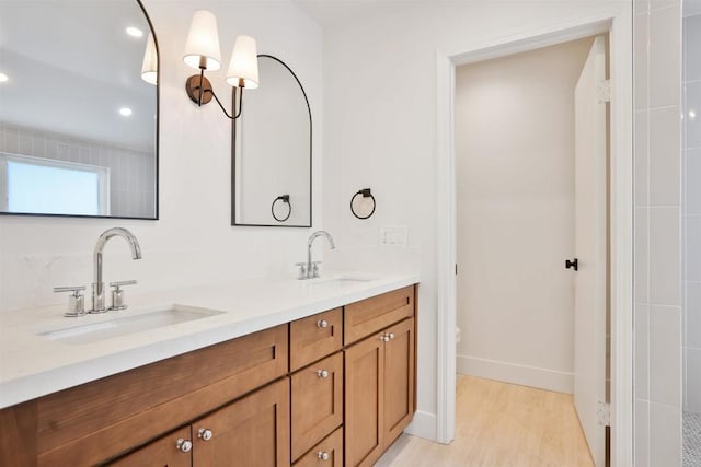 286 E Mission Rd, Corona, CA 92879 - full bathroom with double vanity, wood finished floors, and recessed lighting