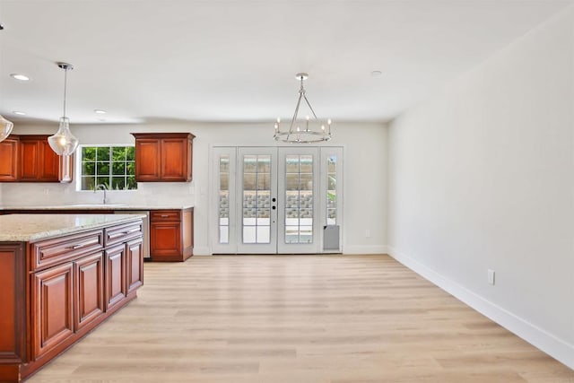 286 E Mission Rd, Corona, CA 92879 - kitchen featuring a chandelier, light wood-style floors, decorative light fixtures, recessed lighting, and stainless steel dishwasher