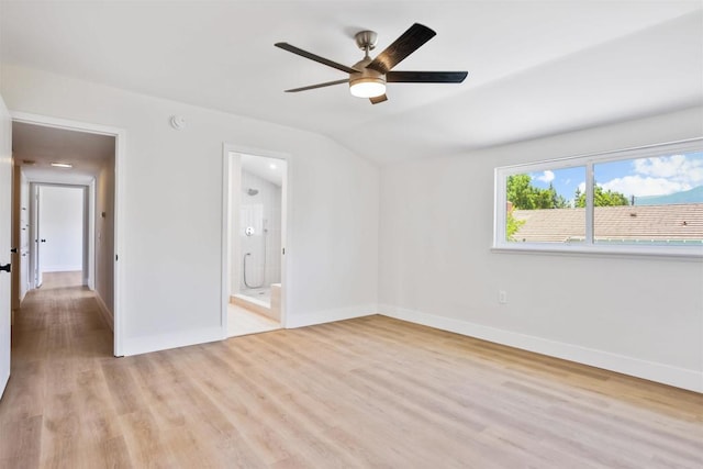 286 E Mission Rd, Corona, CA 92879 - unfurnished bedroom with light wood finished floors, vaulted ceiling, connected bathroom, and a ceiling fan