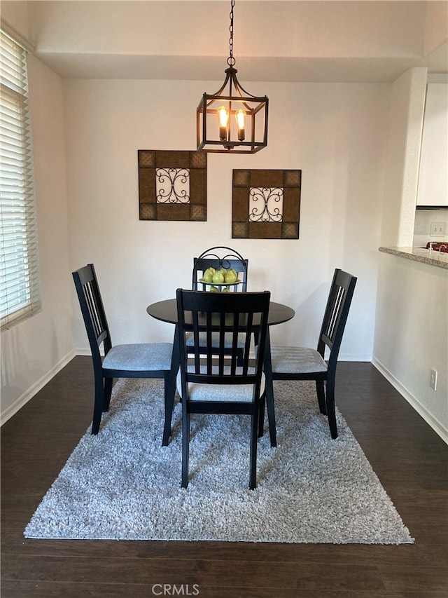 132 Sandpiper Ln, Aliso Viejo, CA 92656 - dining space with a chandelier and dark wood finished floors