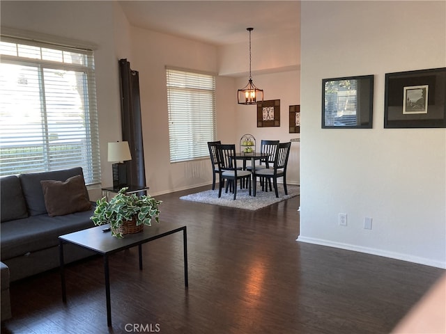 132 Sandpiper Ln, Aliso Viejo, CA 92656 - living room featuring a chandelier and dark wood-style floors