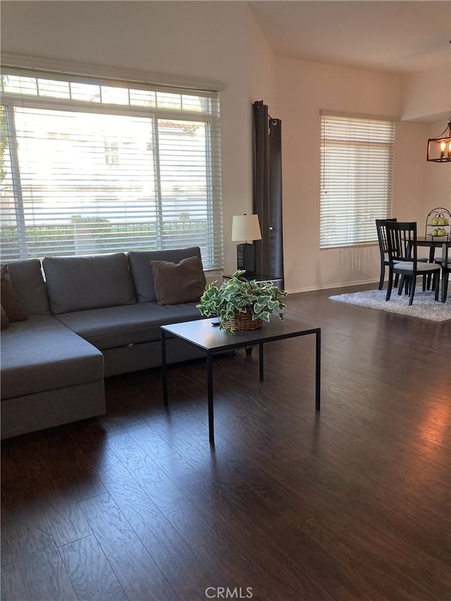 132 Sandpiper Ln, Aliso Viejo, CA 92656 - living area featuring dark wood-style floors, a chandelier, and healthy amount of natural light