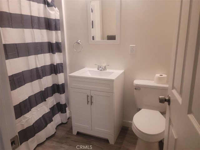 15943 L St, Mojave, CA 93501 - full bathroom with wood finished floors, vanity, and curtained shower