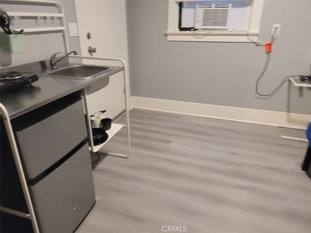 15943 L St, Mojave, CA 93501 - laundry area featuring a sink and light wood-style floors