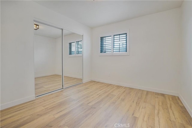 8283 Cornwall Ave, Rancho Cucamonga, CA 91739 - unfurnished bedroom featuring wood finished floors and a closet