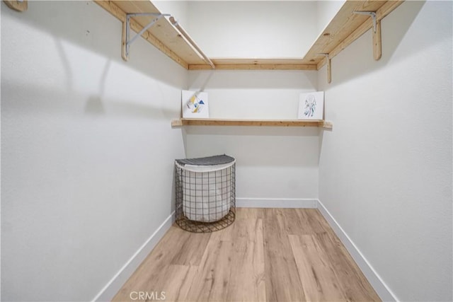 8283 Cornwall Ave, Rancho Cucamonga, CA 91739 - walk in closet with wood finished floors