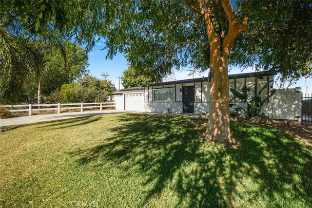 8283 Cornwall Ave, Rancho Cucamonga, CA 91739 - view of yard with an attached garage and driveway
