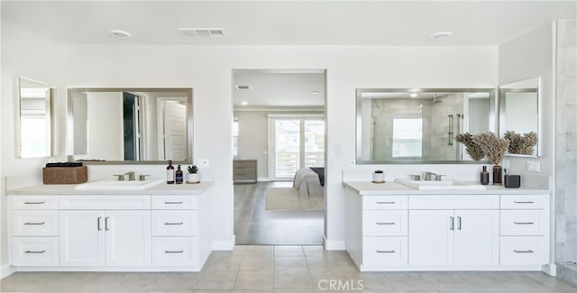 54 Sagan Way, Irvine, CA 92618 - bathroom with two vanities, a shower stall, ensuite bath, and tile patterned flooring
