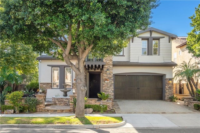 25 Thalia St, Ladera Ranch, CA 92694 - view of front of home featuring stone siding, driveway, and stucco siding