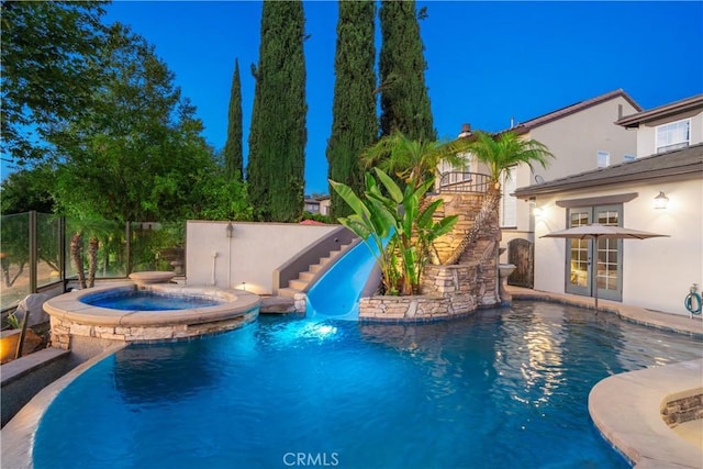 25 Thalia St, Ladera Ranch, CA 92694 - view of pool featuring stairs, a water slide, a pool with connected hot tub, and a patio area