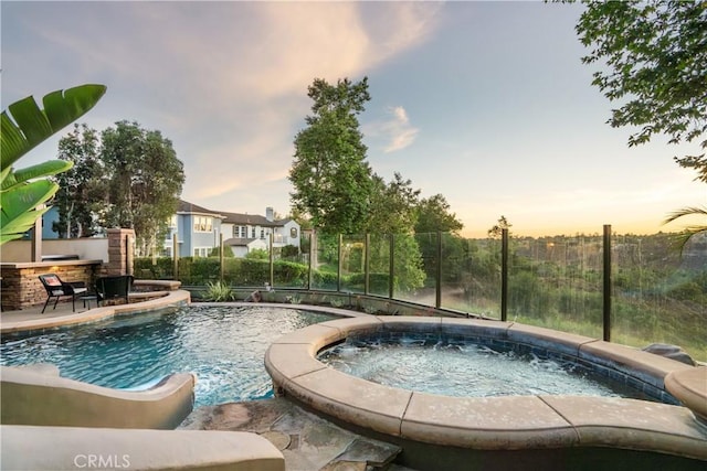 25 Thalia St, Ladera Ranch, CA 92694 - pool at dusk with an in-ground hot tub and an outdoor pool