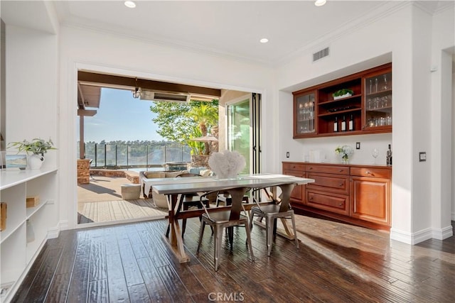 25 Thalia St, Ladera Ranch, CA 92694 - dining area with dark wood-style flooring, crown molding, and recessed lighting