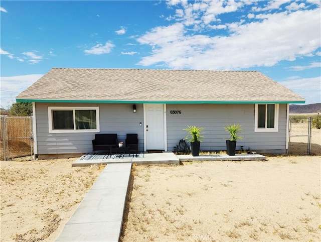 65076 E Broadway, Joshua Tree, CA 92252 - view of front of property with a porch and roof with shingles