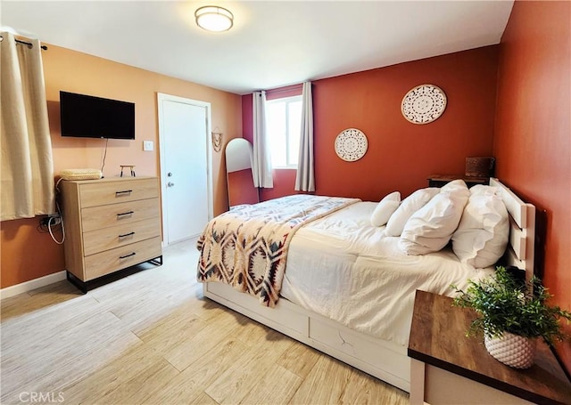 65076 E Broadway, Joshua Tree, CA 92252 - bedroom with light wood-style flooring and baseboards
