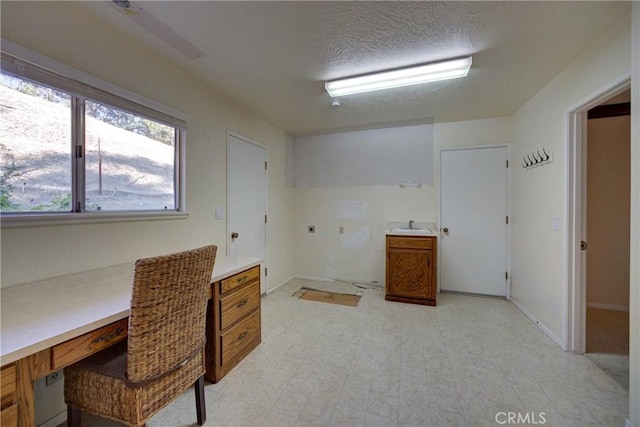 6305 Portola Rd, Atascadero, CA 93422 - unfurnished office featuring a sink and a textured ceiling