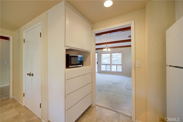 6305 Portola Rd, Atascadero, CA 93422 - corridor featuring light tile patterned floors, light colored carpet, a chandelier, and beamed ceiling