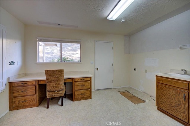 6305 Portola Rd, Atascadero, CA 93422 - unfurnished office featuring light flooring, built in study area, and a textured ceiling