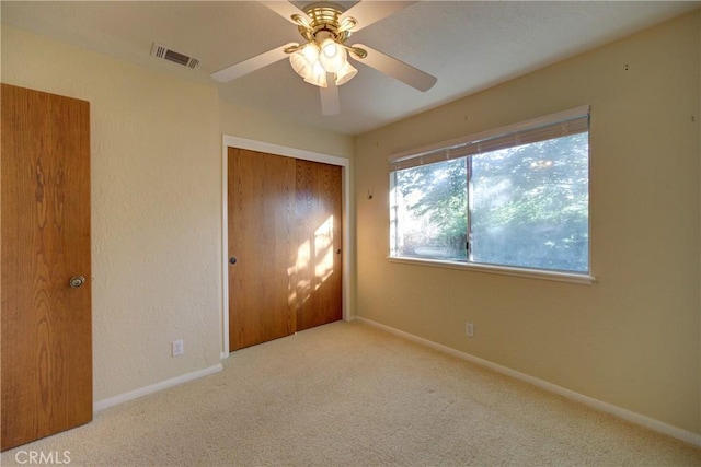 6305 Portola Rd, Atascadero, CA 93422 - unfurnished bedroom featuring carpet, a closet, and ceiling fan