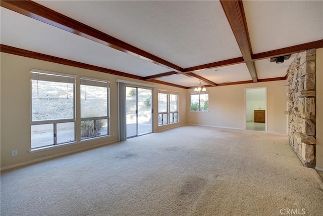 6305 Portola Rd, Atascadero, CA 93422 - unfurnished living room with beamed ceiling, carpet floors, and a chandelier