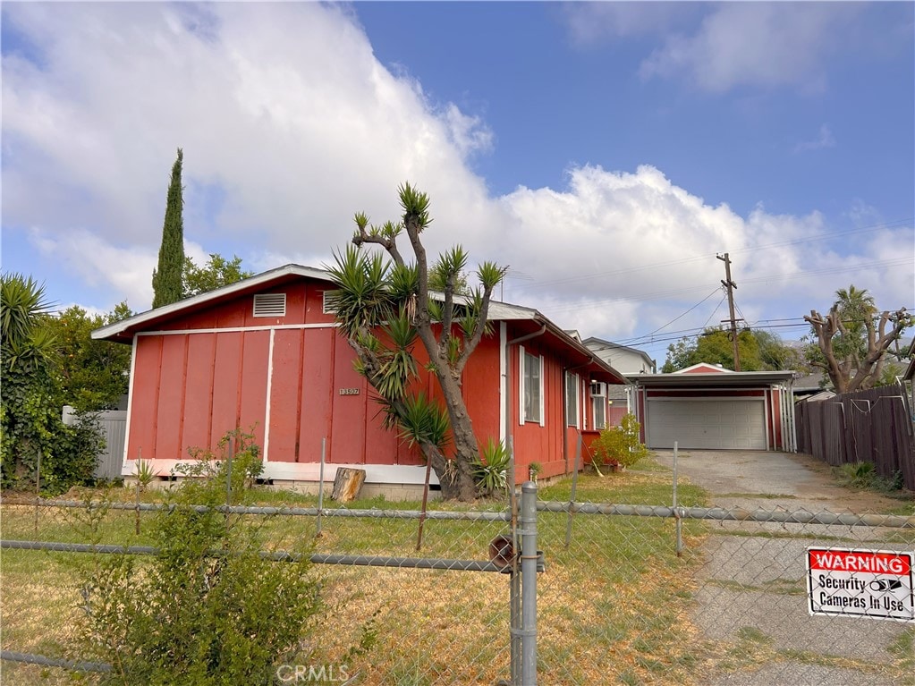 13507 Raven St, Sylmar, CA 91342 - view of front of house featuring an outbuilding and a garage