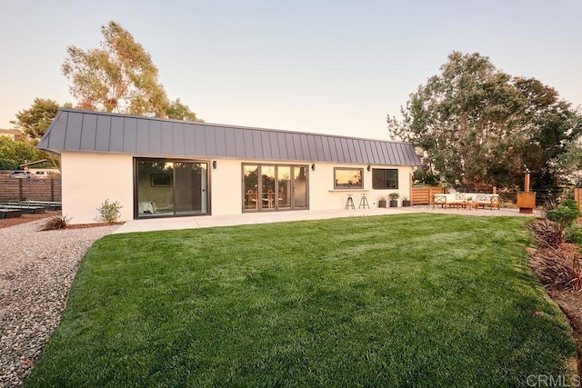 2025 Valley Rd, Oceanside, CA 92056 - rear view of house with stucco siding, a patio, a metal roof, and a standing seam roof