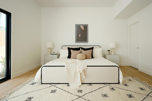 2025 Valley Rd, Oceanside, CA 92056 - bedroom featuring wood finished floors and multiple windows