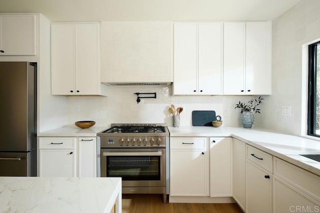 2025 Valley Rd, Oceanside, CA 92056 - kitchen with stainless steel appliances, backsplash, white cabinets, and light stone countertops