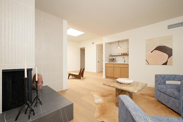 2025 Valley Rd, Oceanside, CA 92056 - living area featuring light wood-type flooring and a fireplace