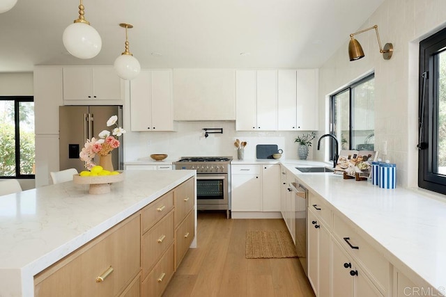 2025 Valley Rd, Oceanside, CA 92056 - kitchen with high end appliances, light wood finished floors, plenty of natural light, and tasteful backsplash