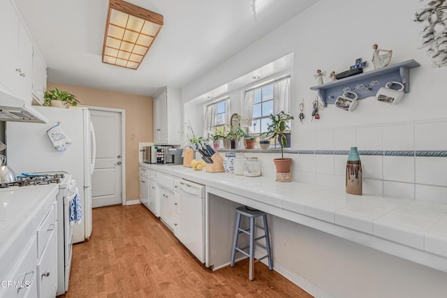 1373 Calle Crisantemo, Thousand Oaks, CA 91360 - kitchen featuring white appliances, white cabinetry, light wood-style floors, and backsplash