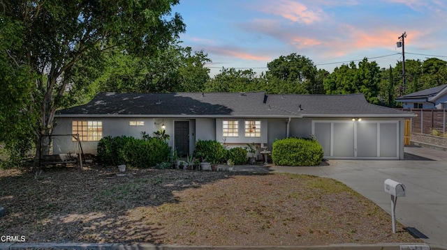 1373 Calle Crisantemo, Thousand Oaks, CA 91360 - ranch-style home featuring concrete driveway, stucco siding, an attached garage, and a shingled roof
