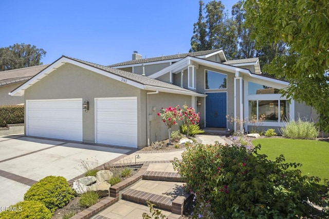 2142 Klamath Dr, Camarillo, CA 93010 - mid-century inspired home with a garage, concrete driveway, a chimney, stucco siding, and a front yard