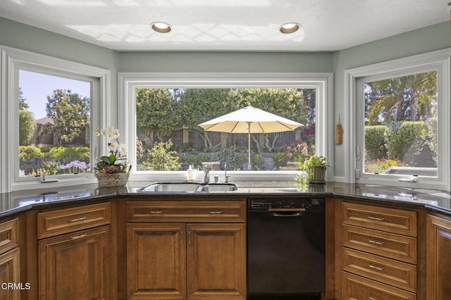 2142 Klamath Dr, Camarillo, CA 93010 - kitchen with black dishwasher, healthy amount of natural light, and brown cabinetry