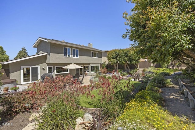 2142 Klamath Dr, Camarillo, CA 93010 - back of house with stucco siding, a patio area, and a chimney