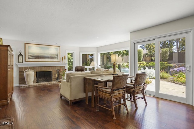 2142 Klamath Dr, Camarillo, CA 93010 - living room with dark wood finished floors, a fireplace, and a textured ceiling