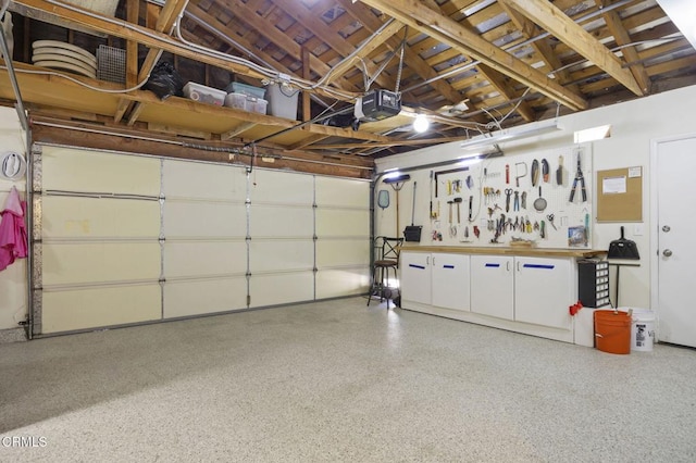 2142 Klamath Dr, Camarillo, CA 93010 - garage featuring a garage door opener and a workshop area
