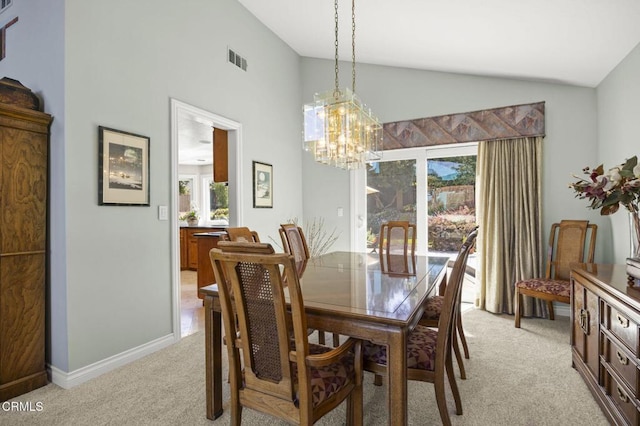 2142 Klamath Dr, Camarillo, CA 93010 - dining area with light carpet, a chandelier, and high vaulted ceiling