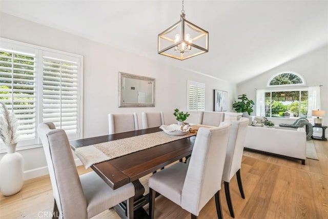 9 Phillips Cir, Laguna Niguel, CA 92677 - dining space featuring a chandelier, light wood-type flooring, and vaulted ceiling
