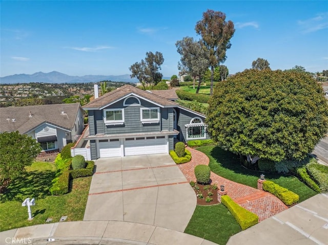 9 Phillips Cir, Laguna Niguel, CA 92677 - view of front of property with an attached garage, driveway, and a mountain view
