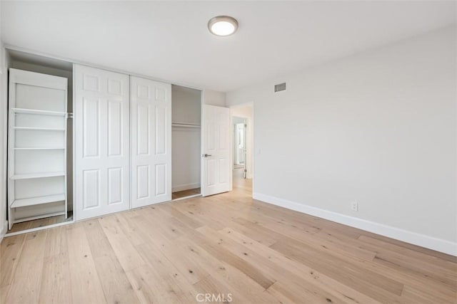9 Phillips Cir, Laguna Niguel, CA 92677 - unfurnished bedroom featuring light wood-style floors and a closet