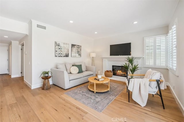 9 Phillips Cir, Laguna Niguel, CA 92677 - living area with a brick fireplace, light wood-style flooring, and recessed lighting