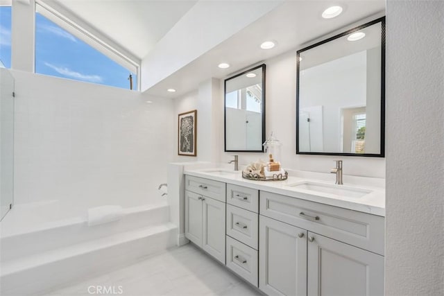 9 Phillips Cir, Laguna Niguel, CA 92677 - full bathroom with double vanity, a tub, and recessed lighting