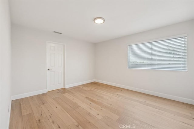 9 Phillips Cir, Laguna Niguel, CA 92677 - spare room featuring light wood-style flooring and baseboards