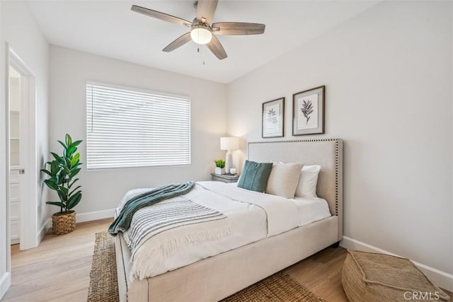 9 Phillips Cir, Laguna Niguel, CA 92677 - bedroom with light wood-style flooring, ceiling fan, and ensuite bathroom