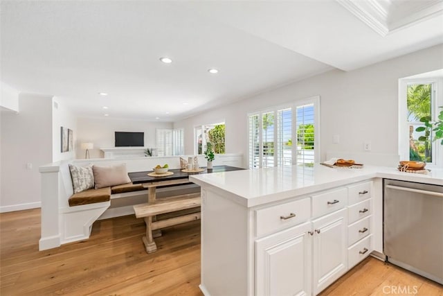 9 Phillips Cir, Laguna Niguel, CA 92677 - kitchen with dishwasher, healthy amount of natural light, light countertops, recessed lighting, and white cabinetry